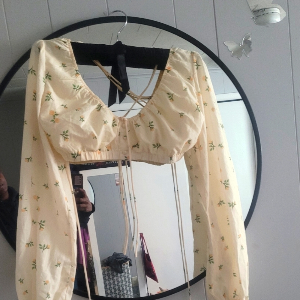 Cute canary yellow crop top with floral prints.